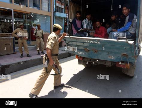 Jammu And Kashmir Police Men Arrest People Not Having Identity Cards During A Cordon And Search