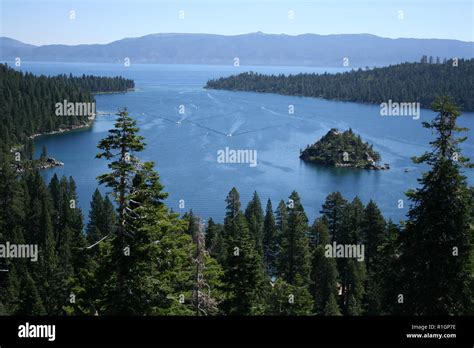 Birdseye view of Lake Tahoe and surrounding evergreen forest ...