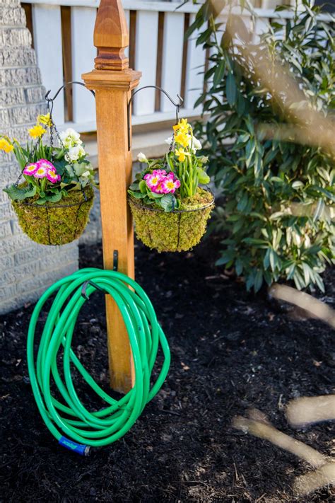 DIY Garden Hose Storage With Plant Hangers HGTV