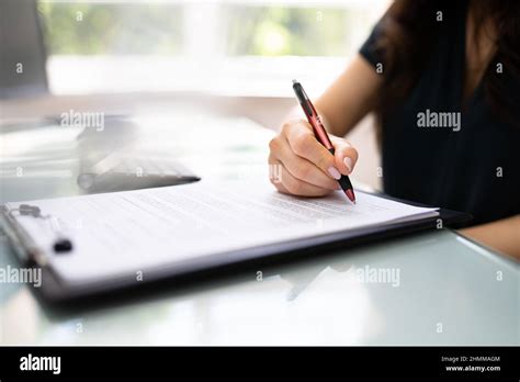 Lawyer Signing Business Contract Paper Document With Pen Stock Photo