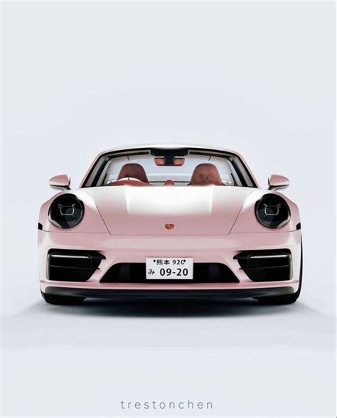 A Pink Porsche Sports Car Parked In Front Of A White Wall