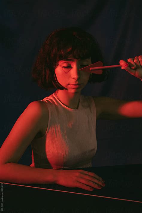 Woman Holding A Heart Shaped Arrow By Stocksy Contributor Iso Duo