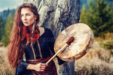 Beautiful Shamanic Girl Playing On Shaman Frame Drum In The Nature