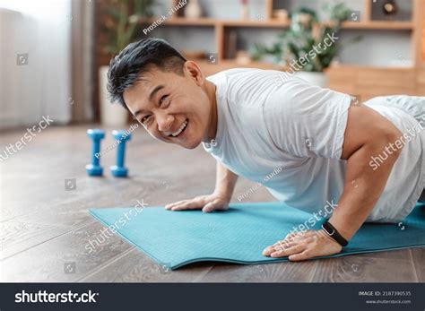 Active Asian Mature Man Standing Plank Stock Photo 2187390535