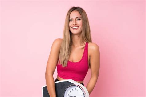 Sporty Blonde Woman With Weighing Machine