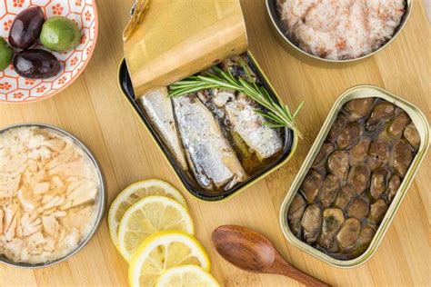 An Assortment Of Food Is Displayed On A Wooden Table With Bowls And