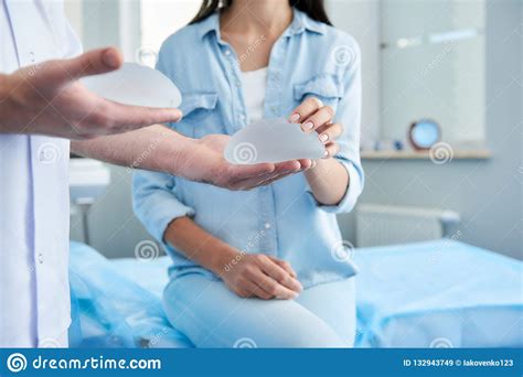 Woman Receiving Consultation Of Plastic Surgeon At The Clinic Stock