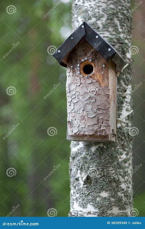 Handmade Birdhouse Hanging On A Tree In The Orchard Stock Image