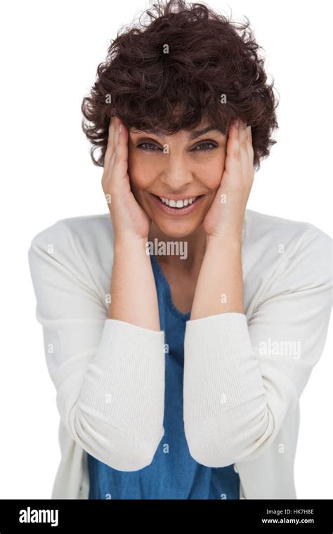 Astonished Brunette Woman Holding Her Head Between Hands On White