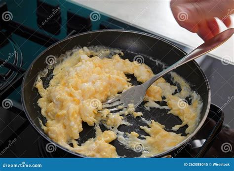 Pan With A Fork Mixing Scrambled Eggs On The Stove Stock Image Image
