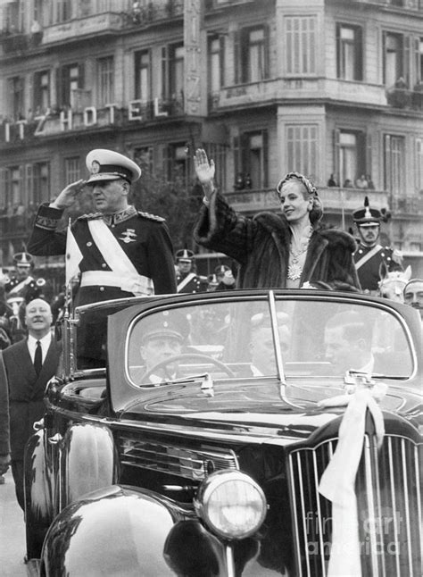 Juan And Eva Peron In Open Car By Bettmann