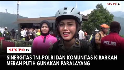 Sinergitas Tni Polri Dan Komunitas Kibarkan Merah Putih Gunakan Paralayang