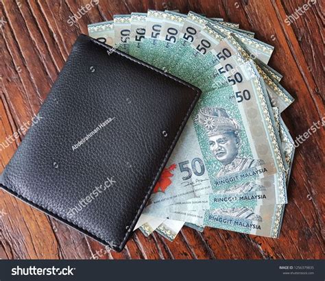 Ringgit Malaysian Banknotes Out Of Black Wallet Malaysian Ringgit