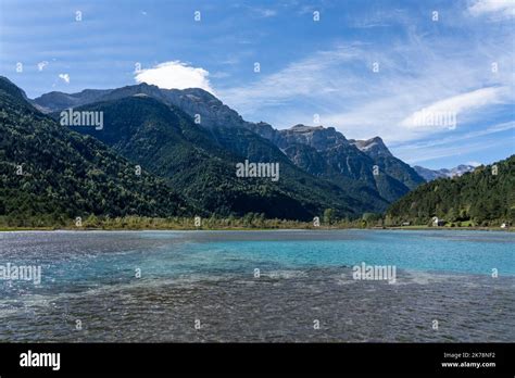 Man Made Aqua Blue Water Reservoir To Feed A Mountain Hydro Power
