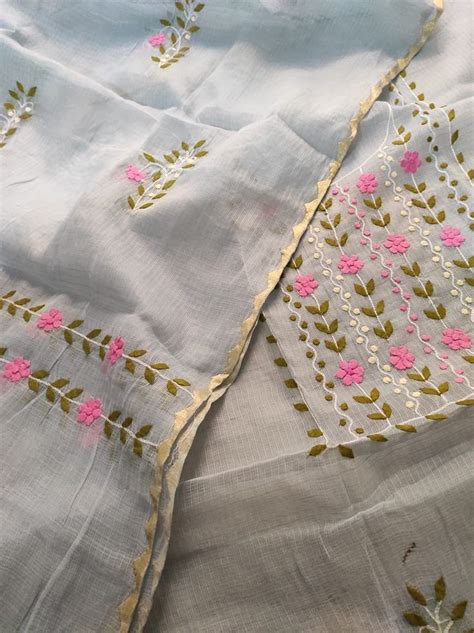 Two White Sheets With Pink Flowers On Them