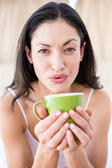 Pretty Brunette Holding Hot Beverage Stock Photo Image Of Pretty Drinking