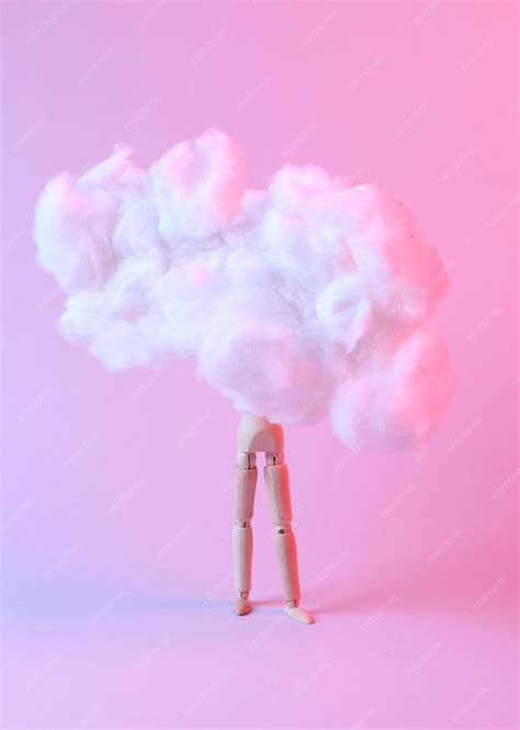 Premium Photo Wooden Puppet In Floating Fluffy Cloud Blue Pink Neon