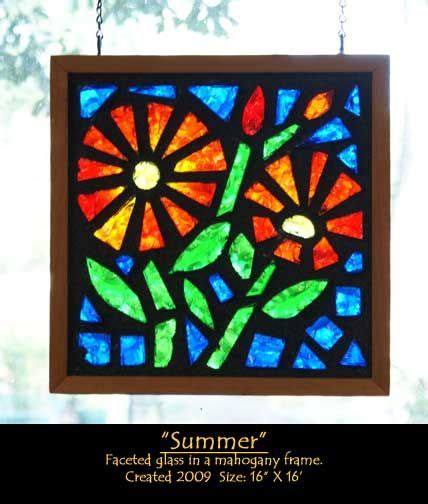 A Stained Glass Window Hanging From A Chain With The Words Summer