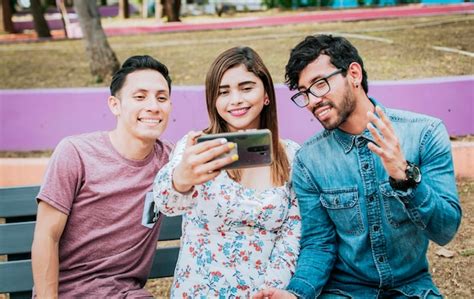 Premium Photo Close Up Of Three Friends Taking A Selfie Sitting In