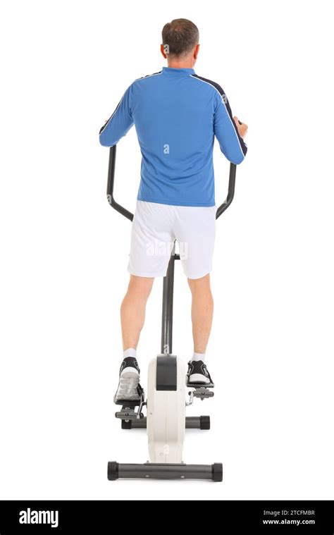 Sporty Mature Man On Exercising Bike Against White Background Back View Stock Photo Alamy