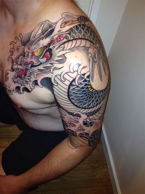 Dragon Wrapping Around Arm Tattoo