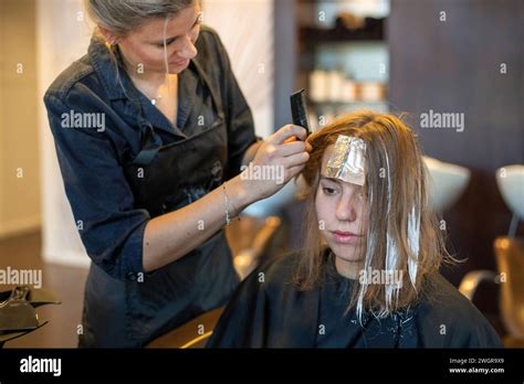 Attractive Blonde Model Having Her Hair Done Relaxing Hair Cut By