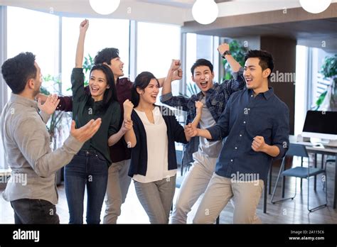 Students cheering in classroom hi-res stock photography and images - Alamy