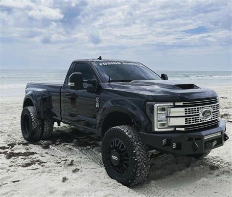 Black Chevy Truck on Sandy Beach