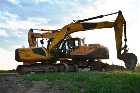 Wheel And Tracked Heavy Excavators Working At Construction Site