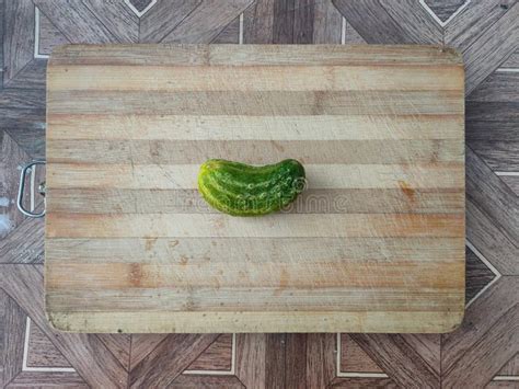 Cucumber On A Wooden Surface Fresh Cucumber On A Cutting Board