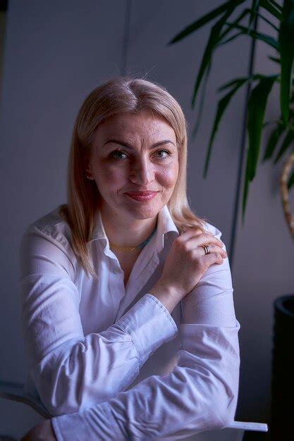 Premium Photo Portrait Of A Blonde Woman In Jeans And A White Shirt