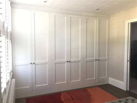 Bespoke fitted wardrobes, painted the exact white chosen by the owners ...