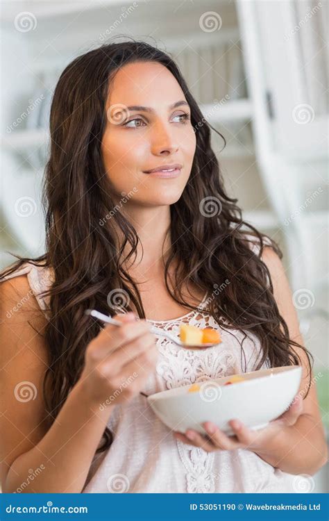 Pretty Brunette Eating A Fruits Salad Stock Photo Image Of Indoors Female 53051190