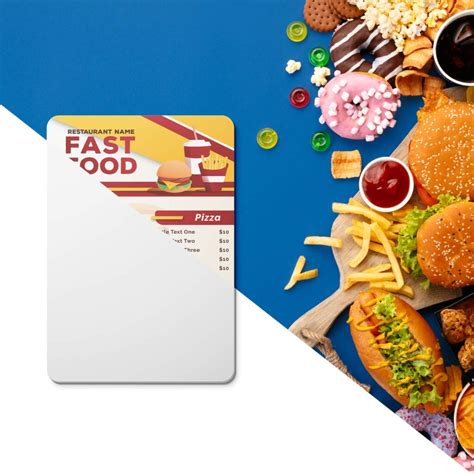 A Fast Food Credit Card Sitting On Top Of A Table Next To Other Foods