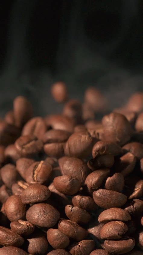 Vertical Slow Motion Of Roasted Coffee Beans Falling Organic Coffee