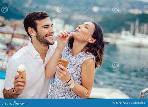 Couple Having Date And Eating Ice Cream On Vacation Sea Background