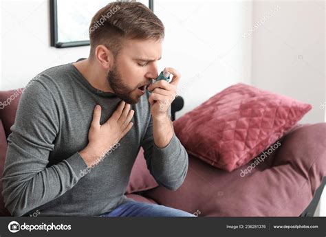 Young Man Inhaler Having Asthma Attack Home Stock Photo by ©serezniy 236281376