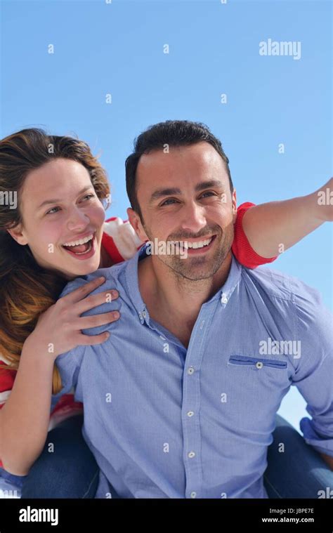 Happy Young Romantic Couple Have Fun Relax Smile At Modern Home Indoor