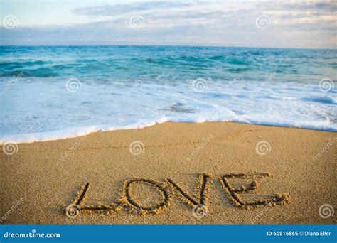 Travel Concept Word Love Written In Sand On The Beach Stock Image