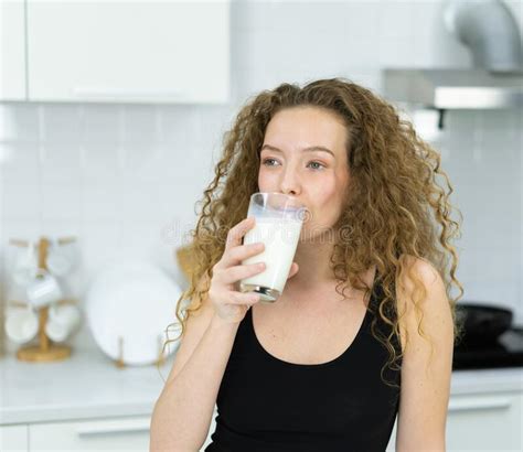 Inspiration Of Vegetarian Woman Drinking Milk Look At Space In Kitchen