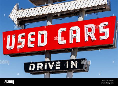 Used Car Drive In Neon Sign From The 50s At A Pre Owned Car Dealership