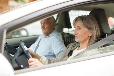 Elderly Married Couple Driving A Car In The City Woman Driving Car Stock Image Image Of Adult