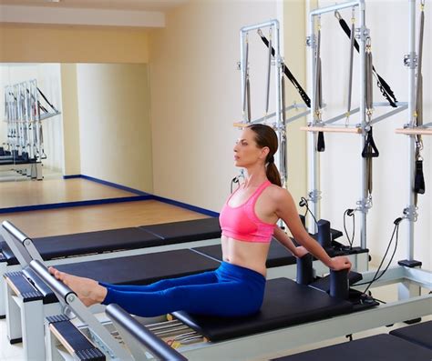 Premium Photo Pilates Reformer Woman Stomach Massage Flat