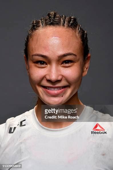 Michelle Waterson Poses For A Post Fight Portrait Backstage During