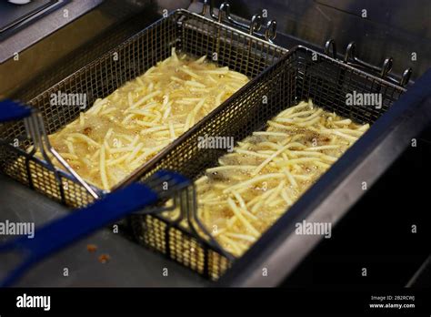 Cooking French Fries Close Up Of Frying French Fries In The Fryer In Hot Oil Stock Photo Alamy