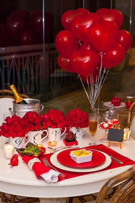 A Table Set For Valentines Day With Red Roses And Balloons