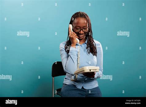 African woman landline phone hi-res stock photography and images - Alamy