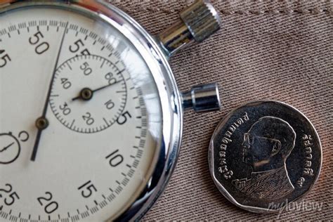 Thai Coin With A Denomination Of Five Baht Back Side And Stopwatch