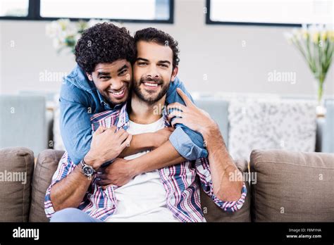 Portrait Of Smiling Gay Couple Hugging Stock Photo Alamy