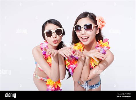 Two Women In Bikini Flower Hi Res Stock Photography And Images Alamy